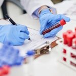Doctor explaining liquid biopsy blood test for early cancer detection and monitoring